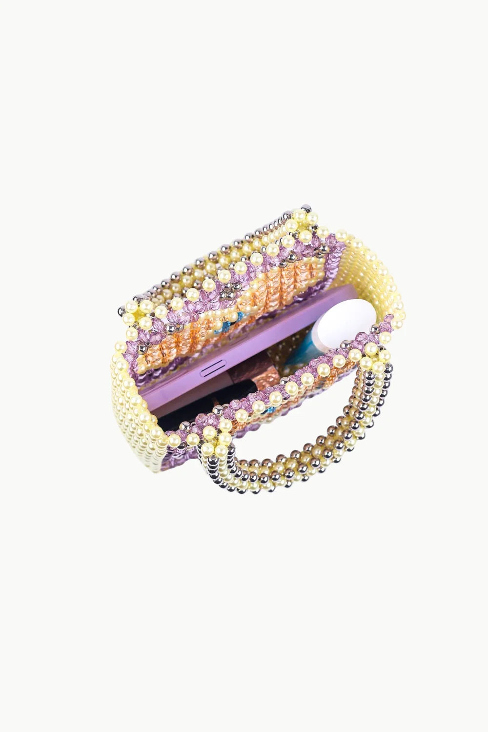 Open beaded heart bag with yellow, purple, orange beads holding a purple and white object