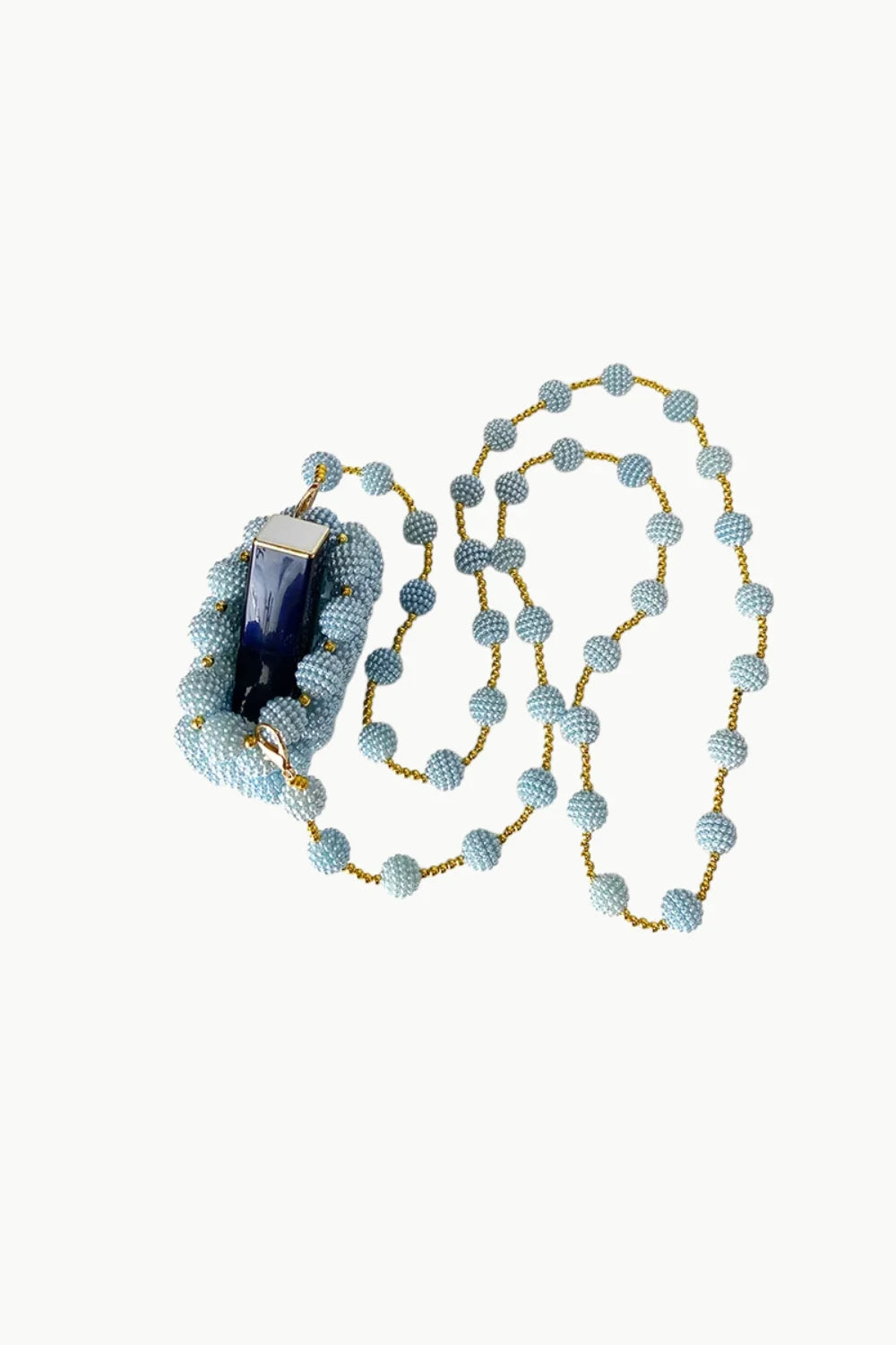 Light blue beaded bracelet with dark blue pendant and matching mini beaded bag