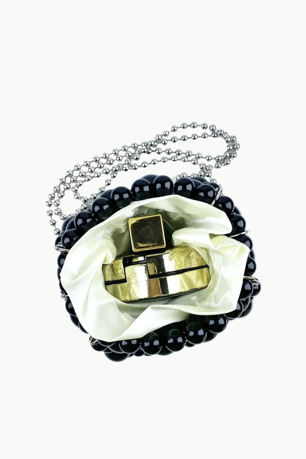 Beaded bucket bag with silver chain strap and perfume inside for everyday style