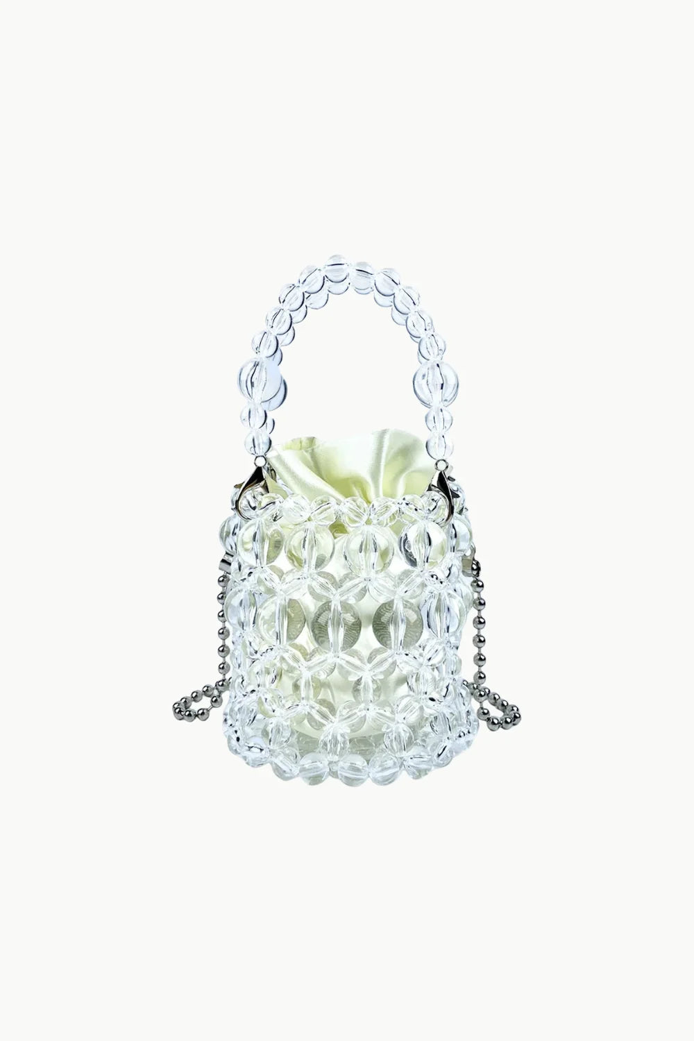 Clear beaded bucket bag with beaded top handle and light yellow drawstring pouch for everyday style