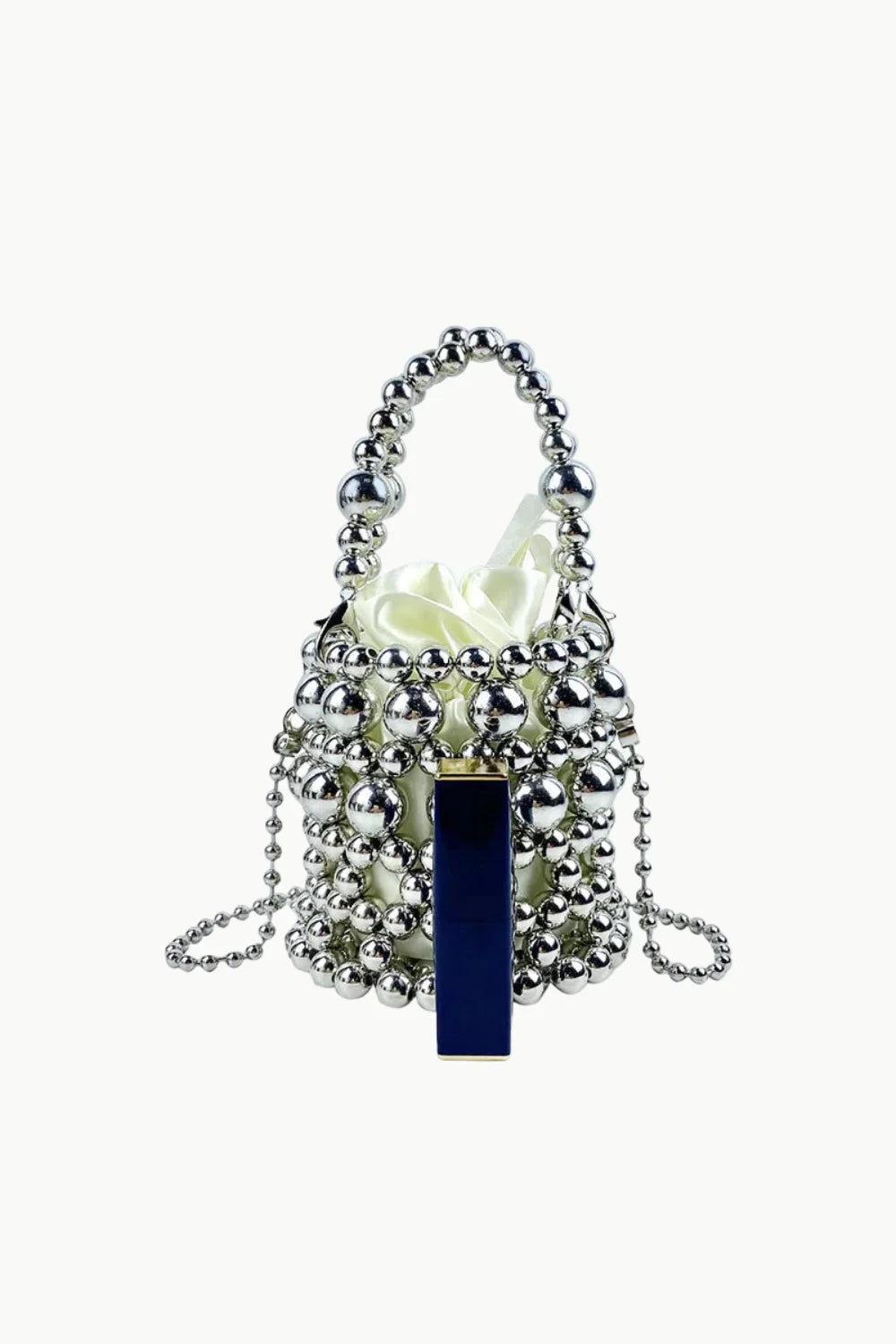 Silver beaded bucket bag with dark blue lipstick and white cloth interior for everyday style