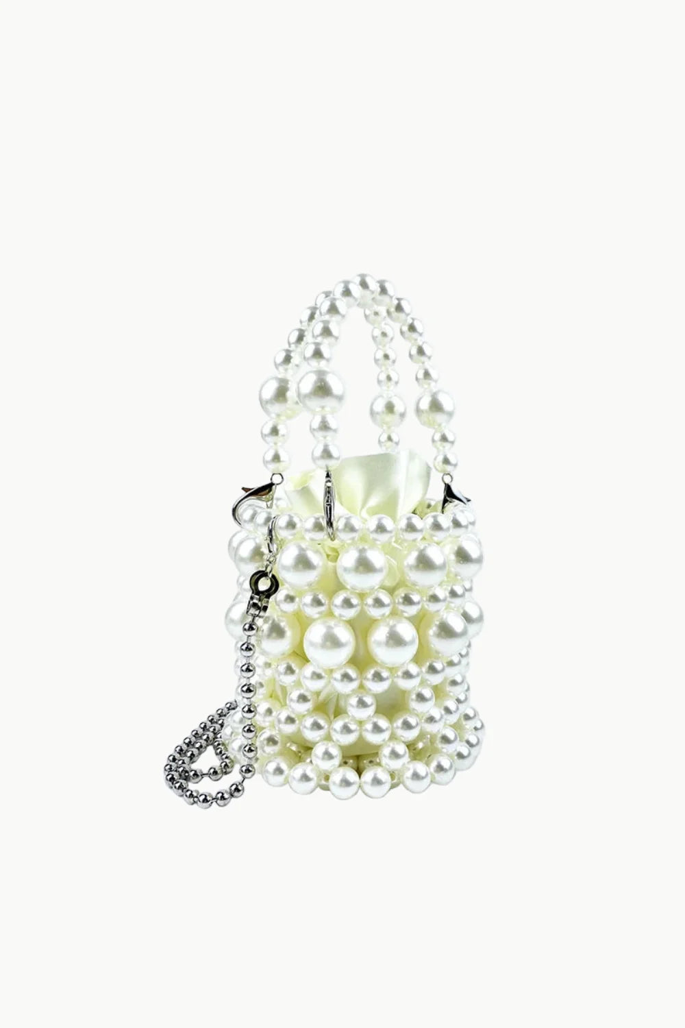 White beaded bucket bag with silver chain strap for everyday style and elegance