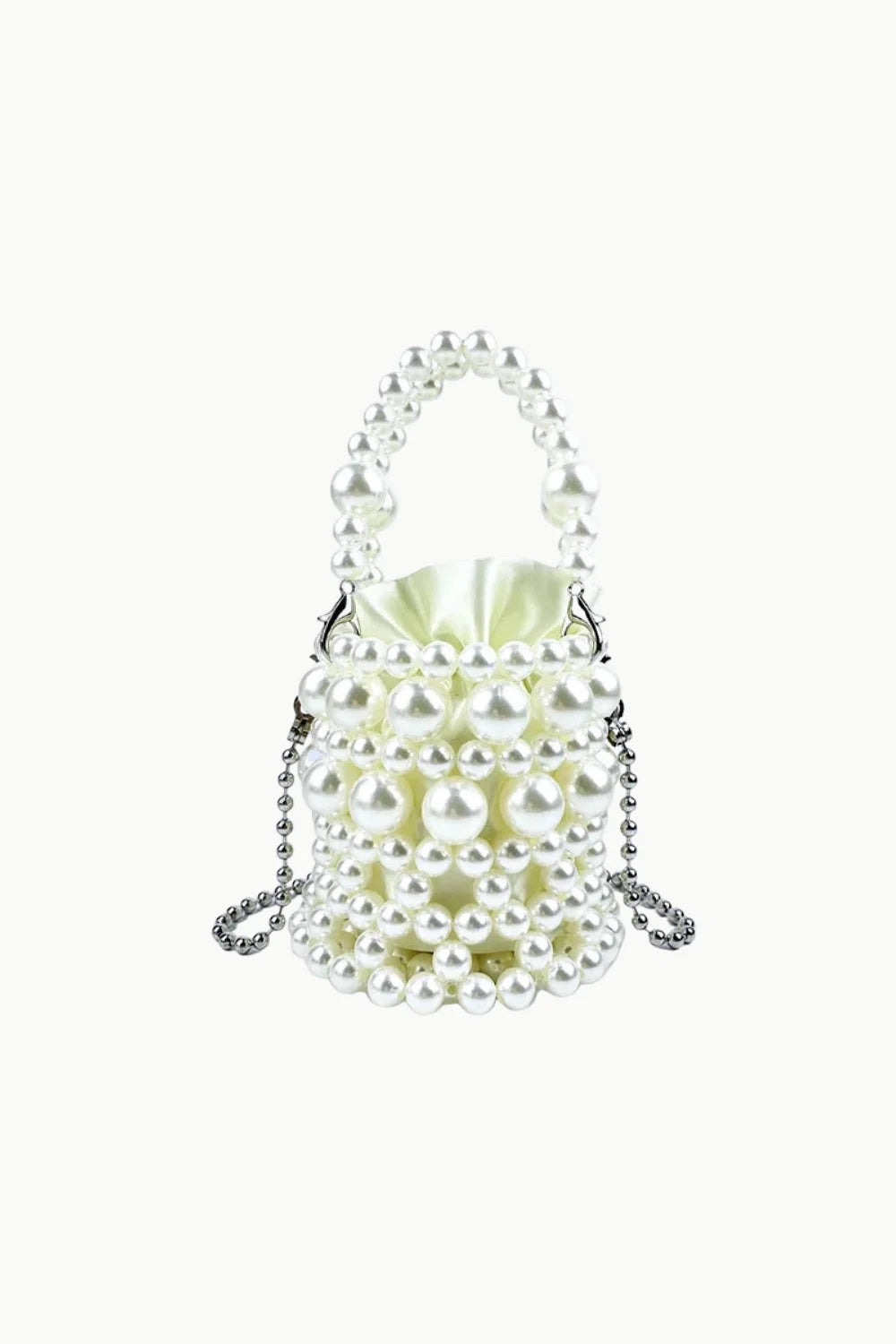 White pearl-beaded bucket bag with top handle and chain strap for everyday style
