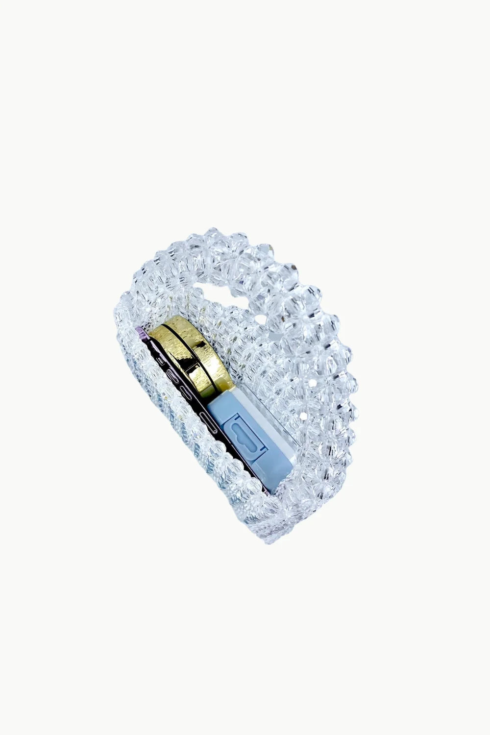 Clear beaded bag with gold and light blue items inside showcasing a stylish beaded bag