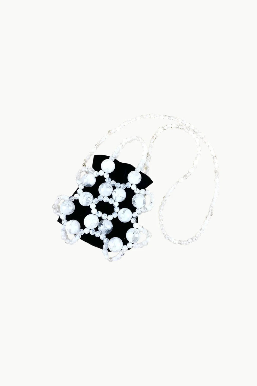 Black pouch-style handbag with white beaded honeycomb pattern and clear strap, gold beaded bucket bag