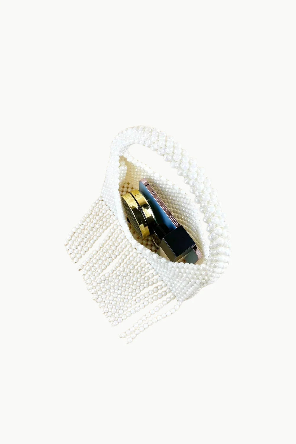 White crochet beaded purse with gold and black contents, stylish hand beaded purse accessory