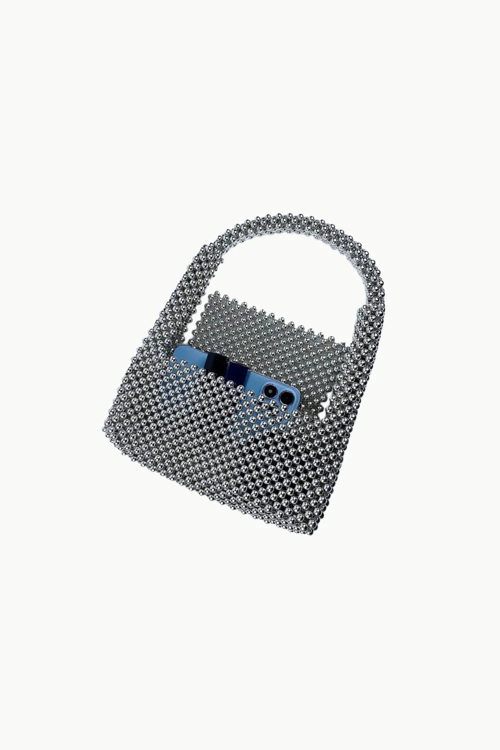 Silver metallic bead purse with blue smartphone inside showcasing stylish bead purse design