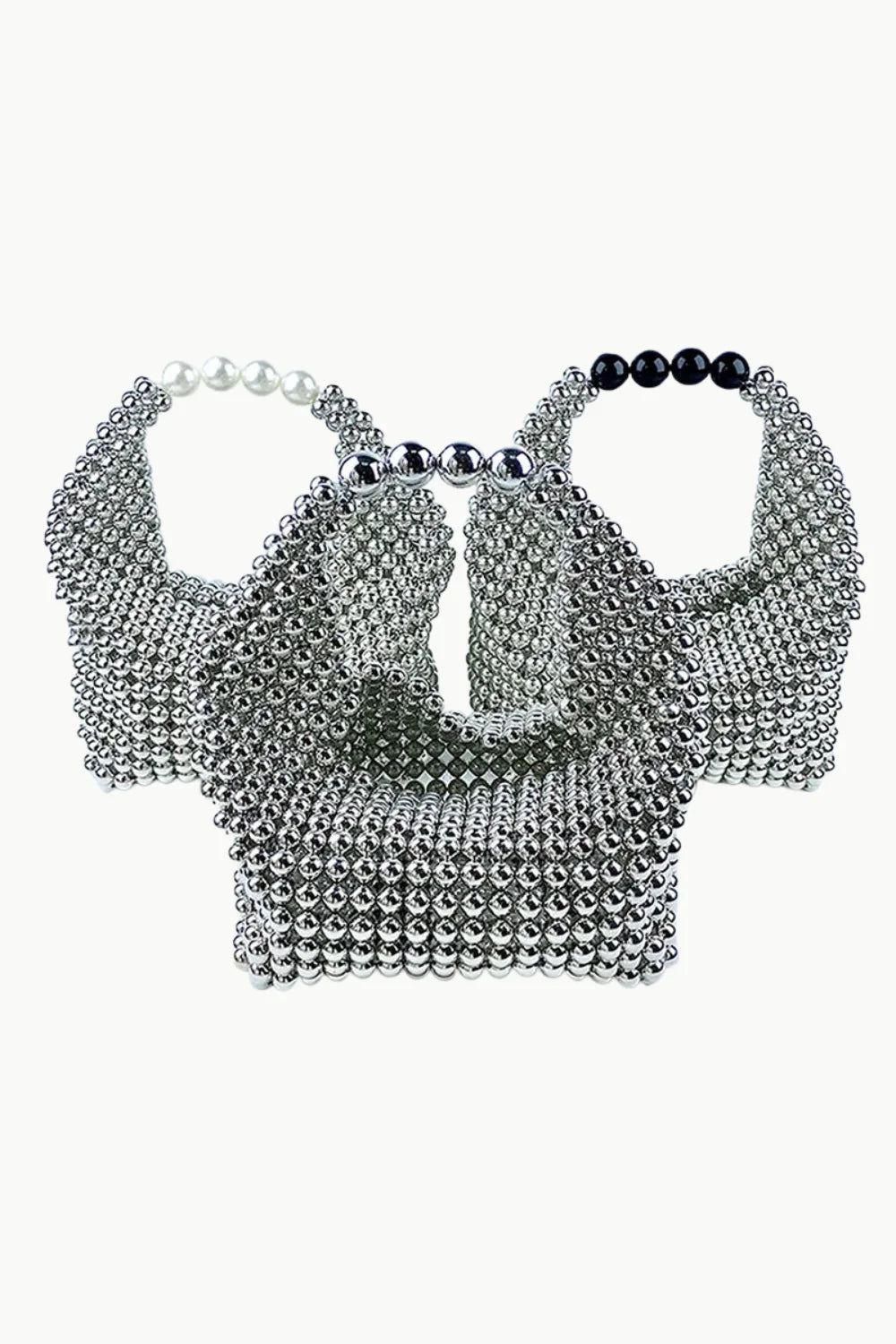 Silver metallic beaded bag with black, white, and silver pearl handles for stylish accessorizing