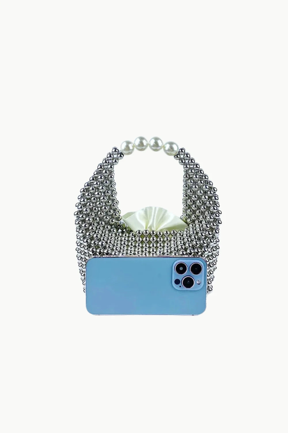 Metallic Beaded Bag with pearl handle and light blue smartphone in front