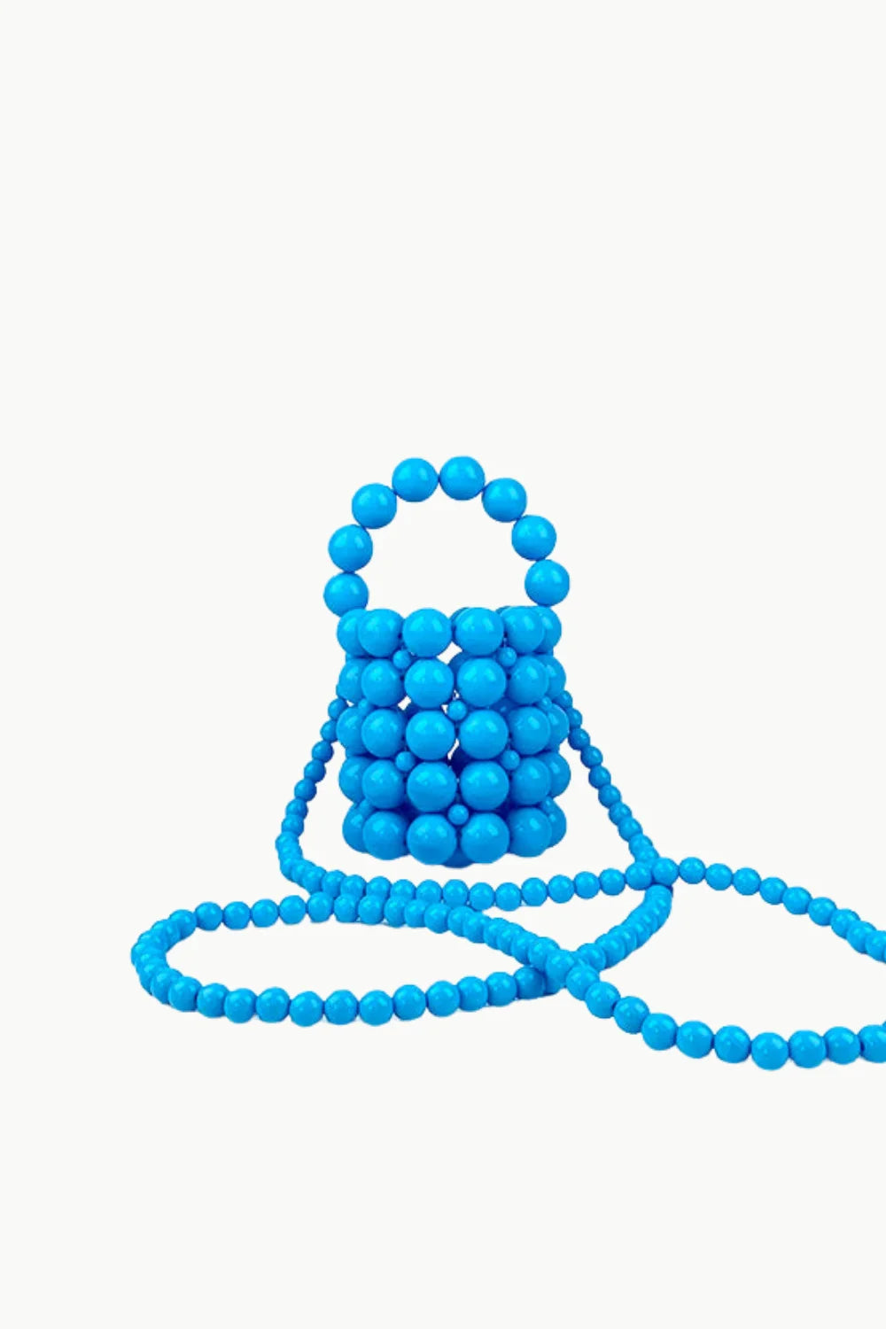 Bright blue beaded bucket bag with a long shoulder strap, perfect for stylish looks