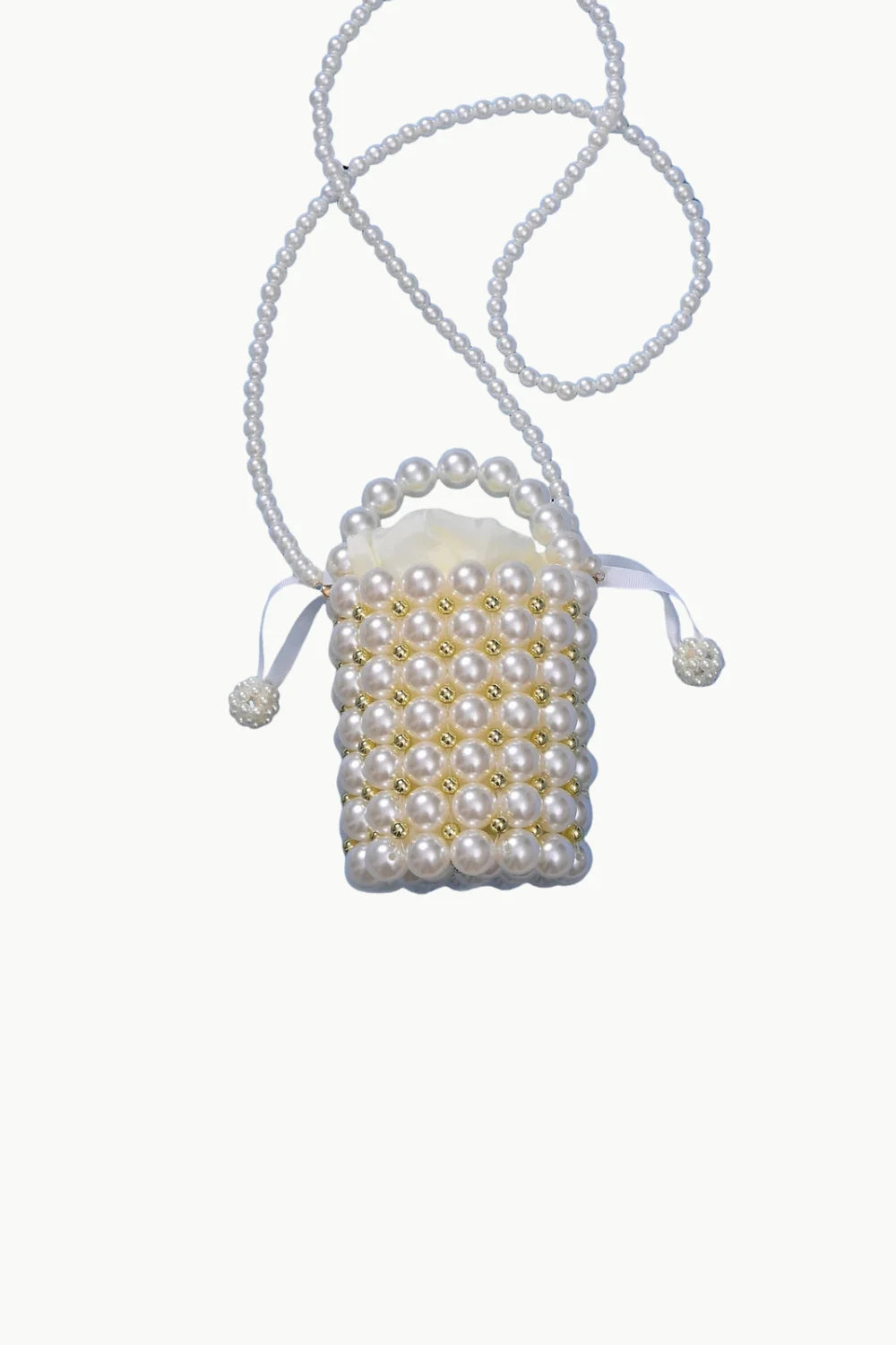 White beaded pearl bucket bag with long strap and drawstring closure for stylish look