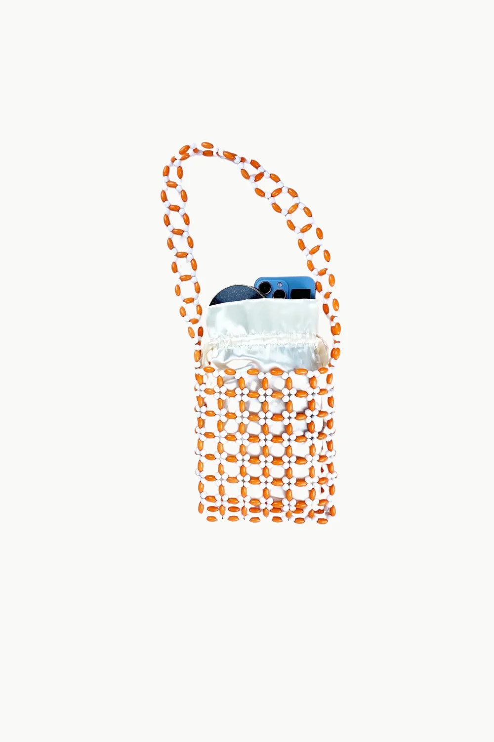 Beaded crossbody bag with light brown cylindrical design and white blue interior