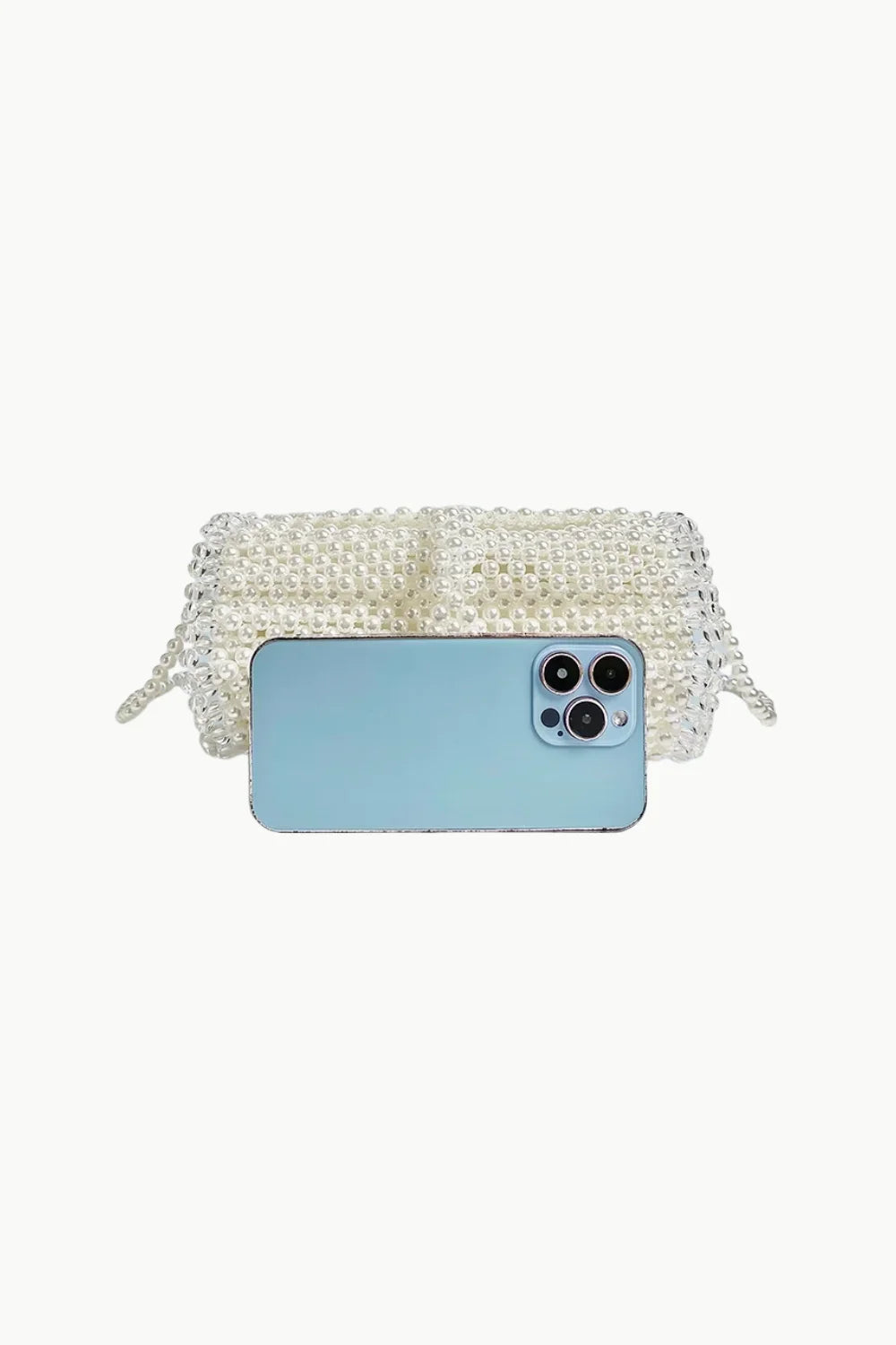 White pearl bag with bag chain and light blue smartphone in front for Pearl Bag Chain