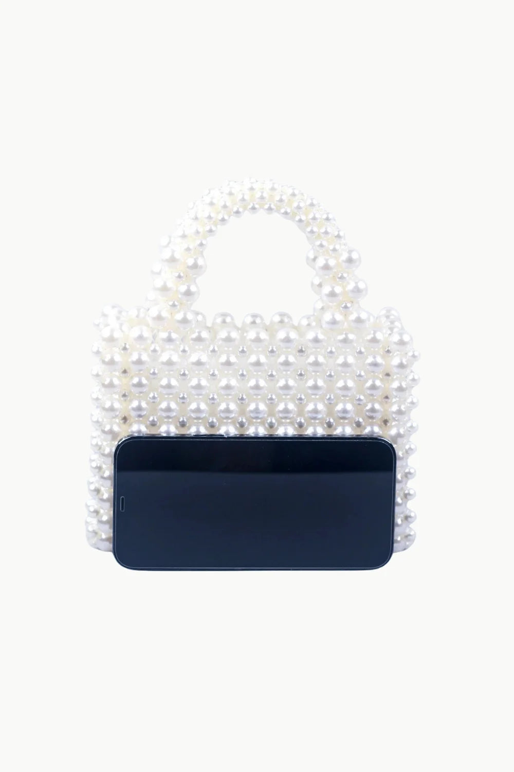 White faux pearl beaded hand bag with dark smartphone in front for Pearl Hand Bag product