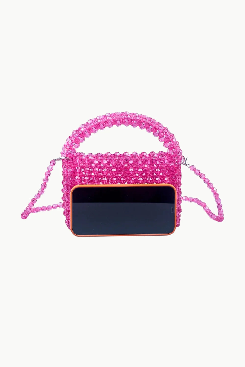 Pink Beaded Bag Charm with top handle and detachable strap shown with smartphone for scale