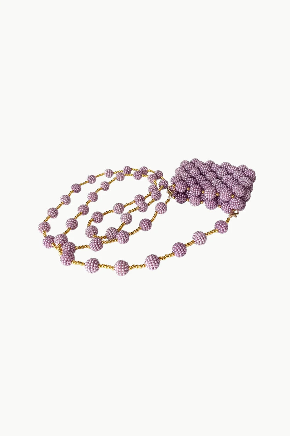 Pink beaded mini bag featuring a long lavender beaded necklace with gold accents