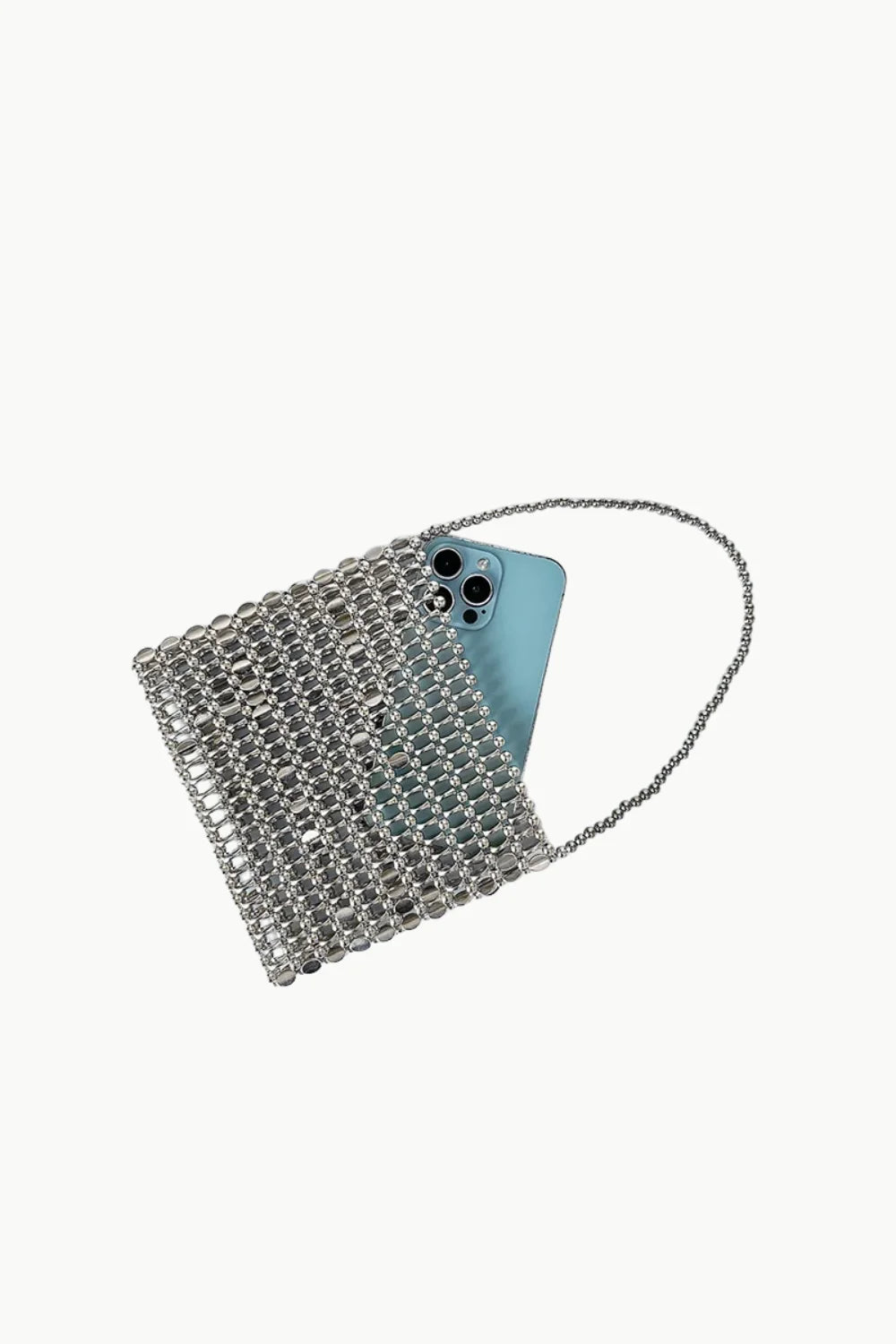 Shiny bead handbag with silver shoulder strap holding a light blue smartphone