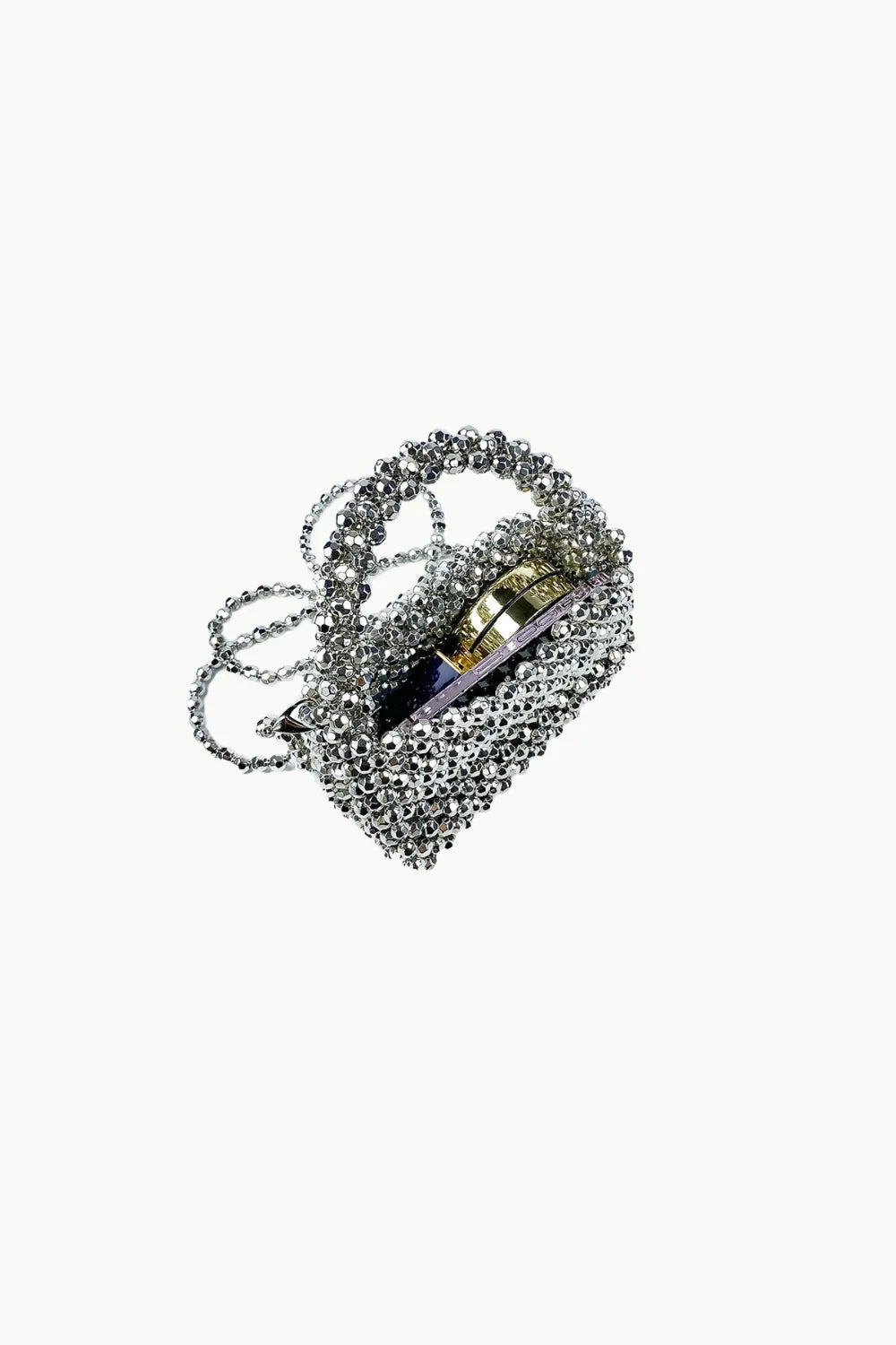 Silver beaded evening bag with gold ring and dark interior for elegant events