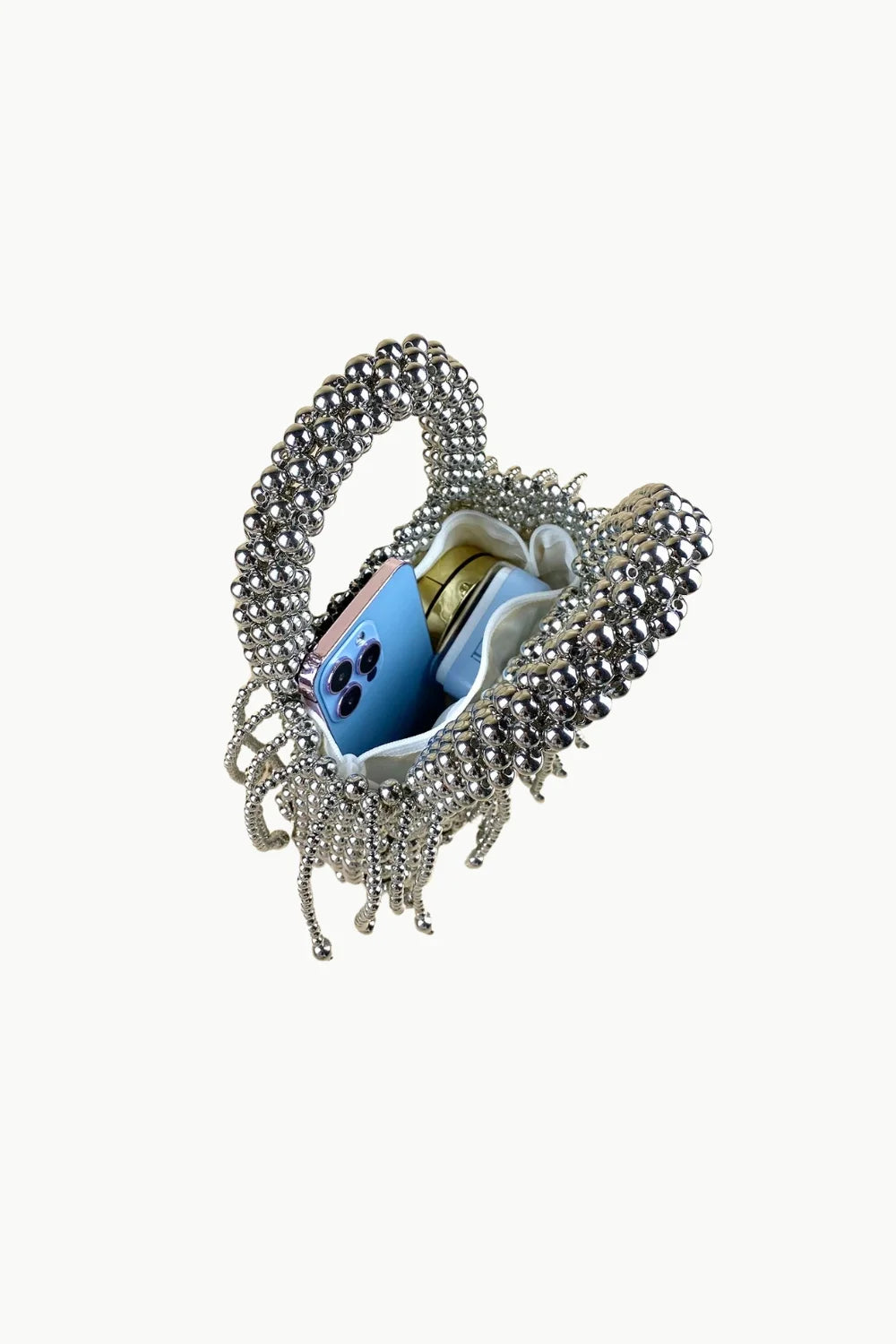 Silver beaded small beaded bag with light blue smartphone inside for stylish accessories