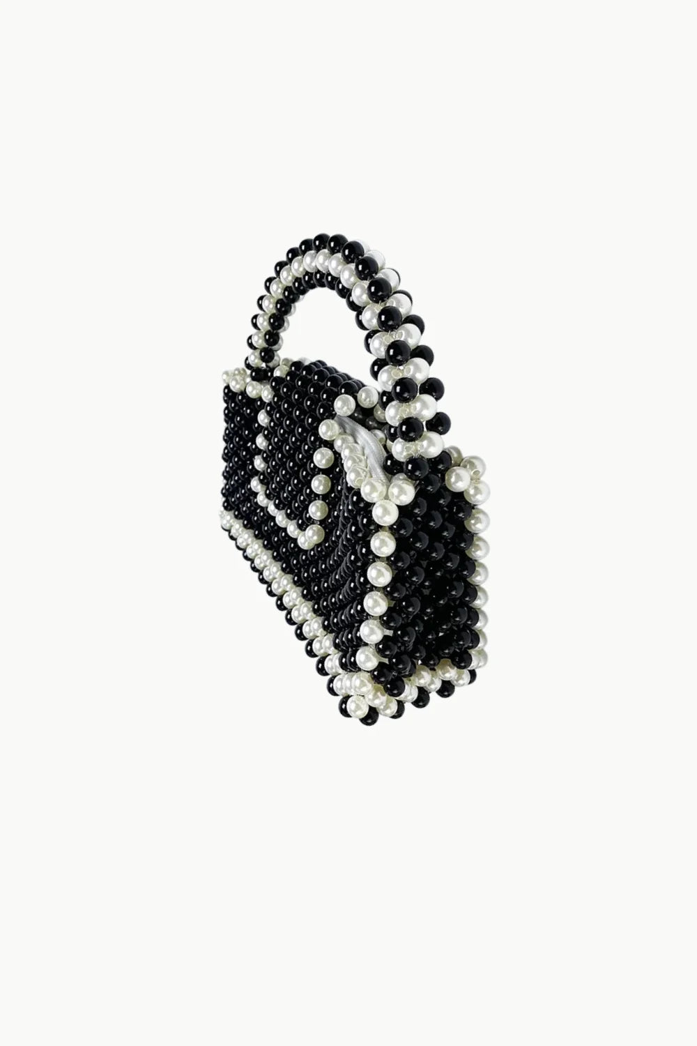 Vintage black beaded purse with structured black and white spherical beads and top handle