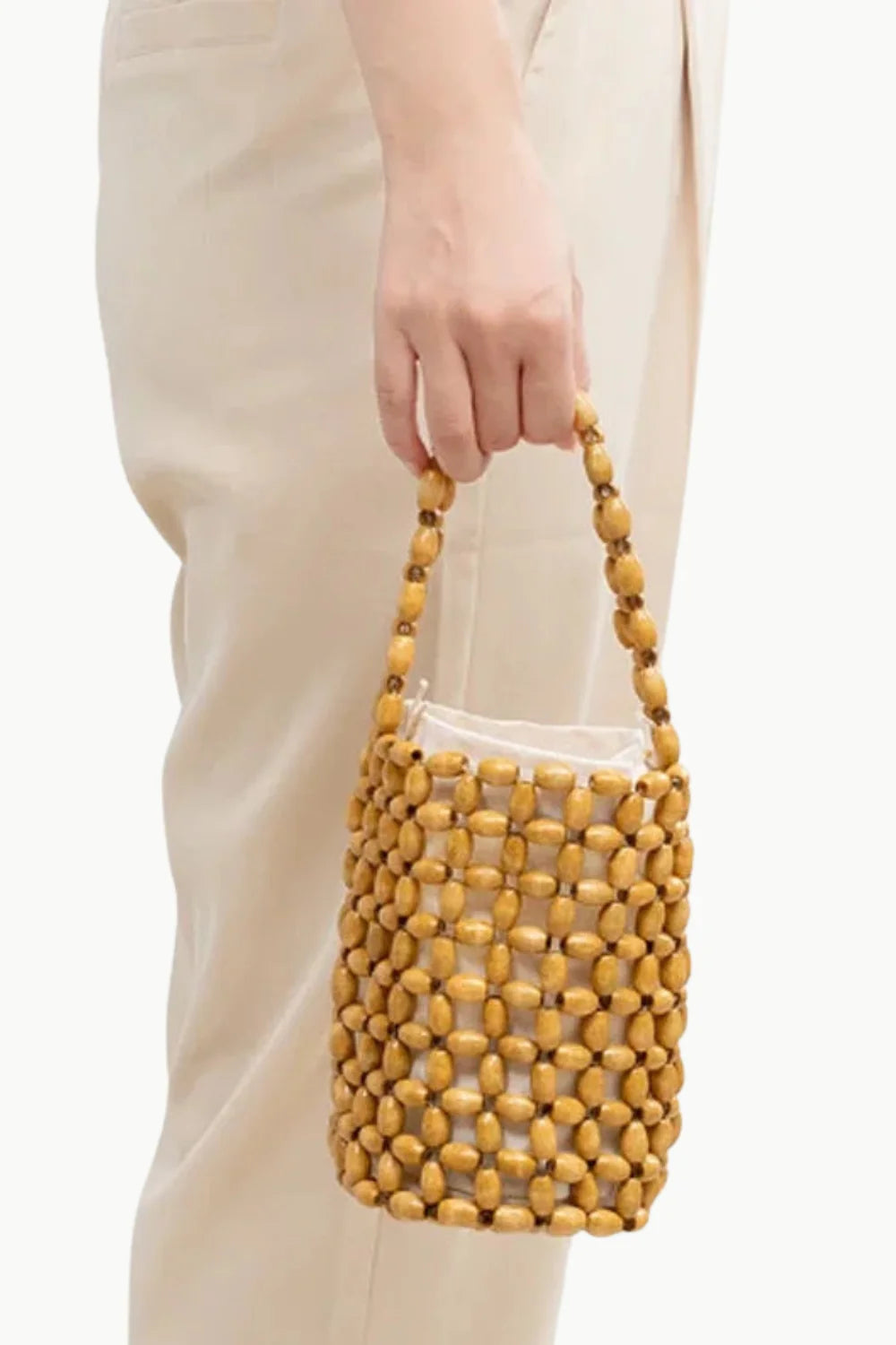 Light brown beaded bucket bag with top handle, stylish beaded bucket bag accessory