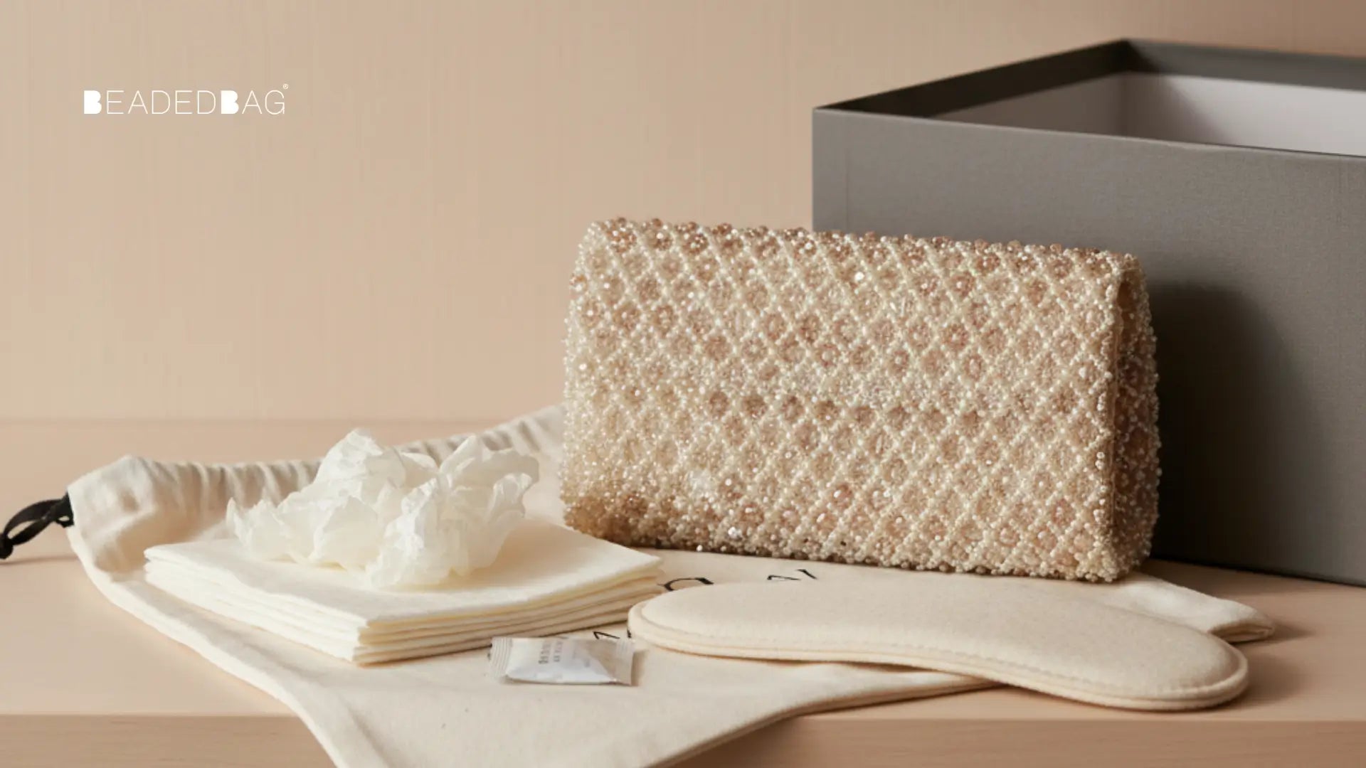 Beaded bag protected with dust bag, tissue, and silica gel, emphasizing careful storage and preservation. Image