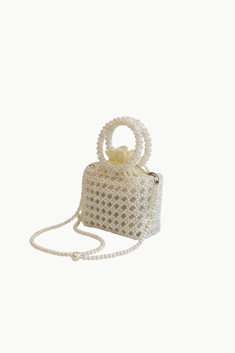 White pearl beaded handbag with top handles and long shoulder strap for elegant style
