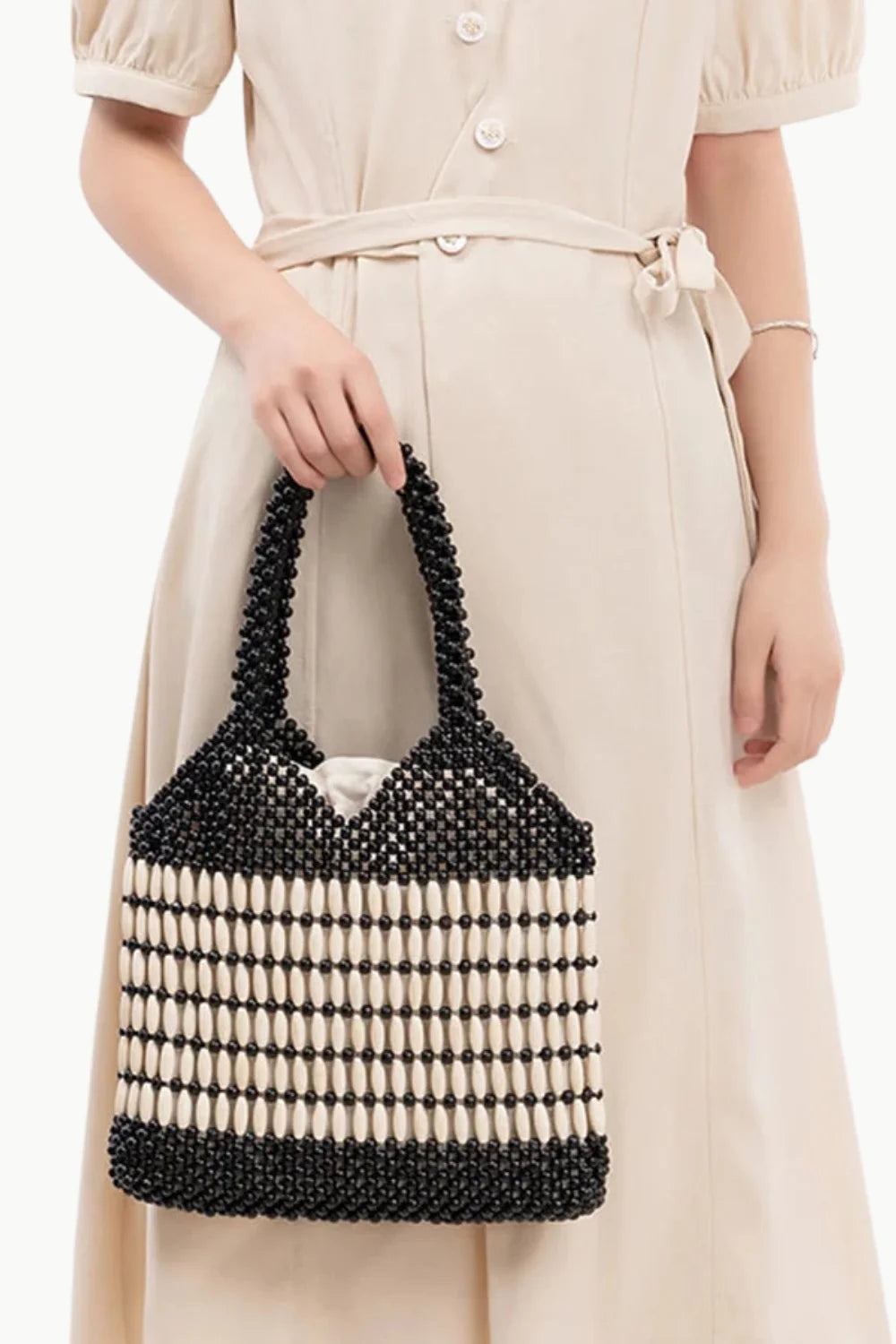 Black and white wooden beaded handbag with top handle made from polyester main material