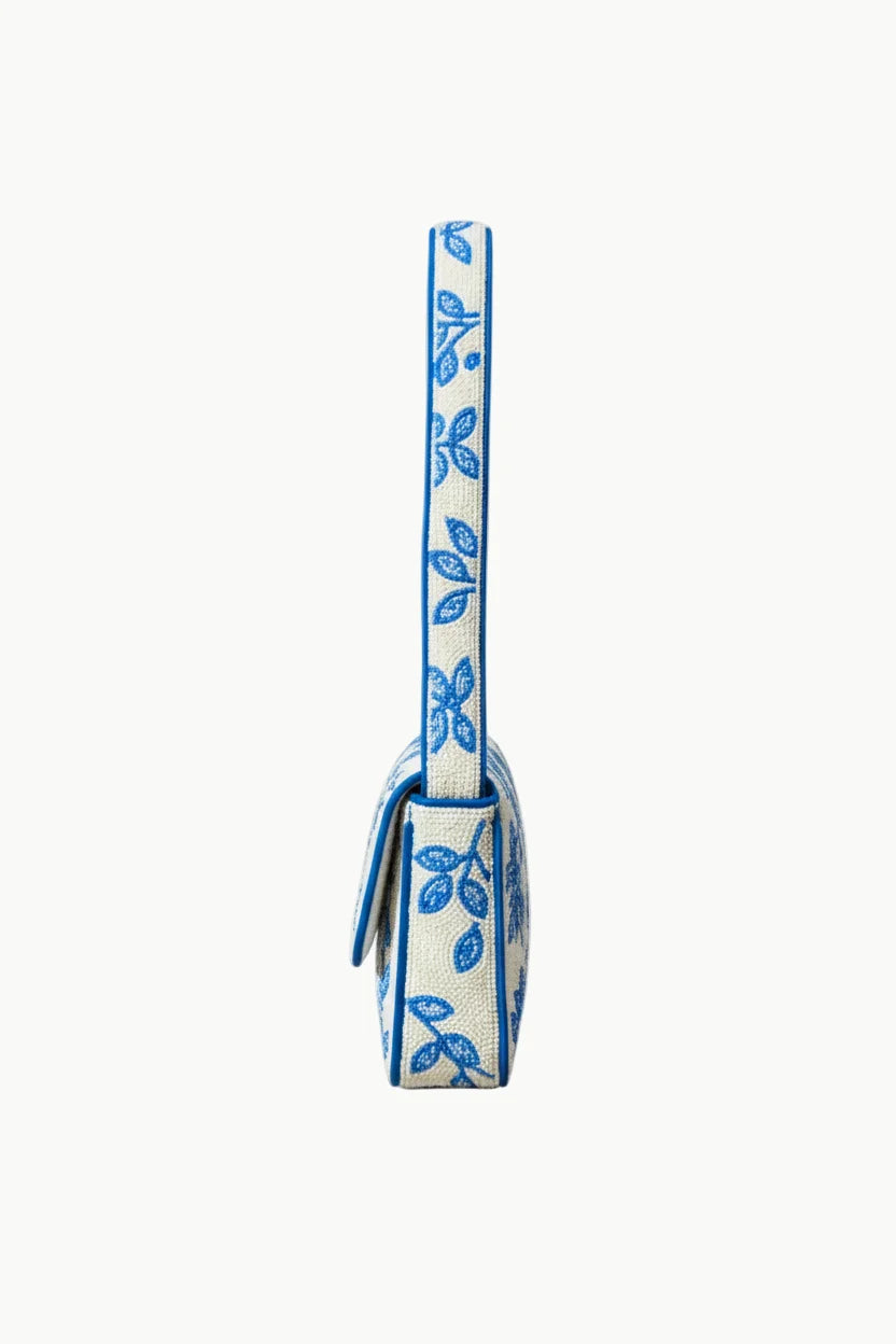 White and blue floral embroidered shoulder bag from Bags With Beads, a stylish beaded handbag for women