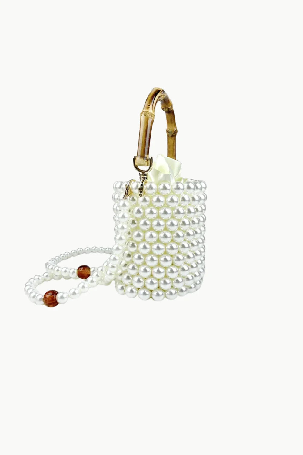 White pearl-beaded bucket bag with bamboo top handle and pearl amber shoulder strap