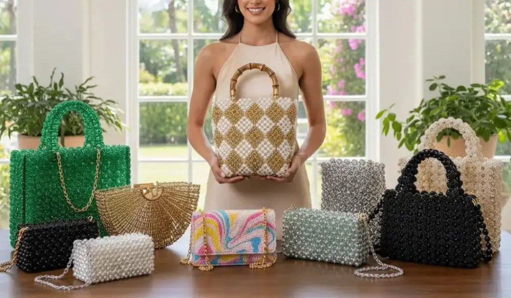 Woman displaying handcrafted beaded bags collection on table