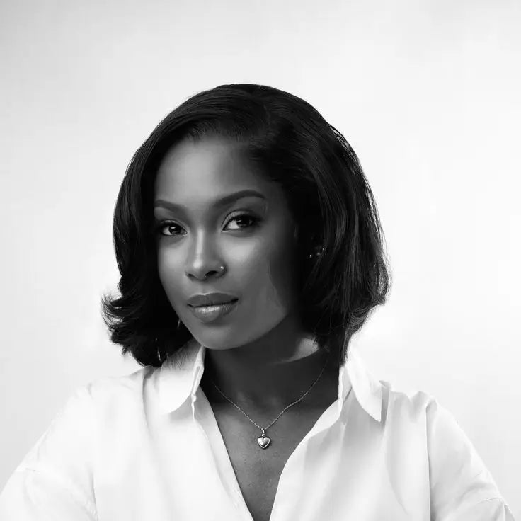 Elegant woman in a white shirt, refined studio portrait highlighting Beaded Bag premium craftsmanship
