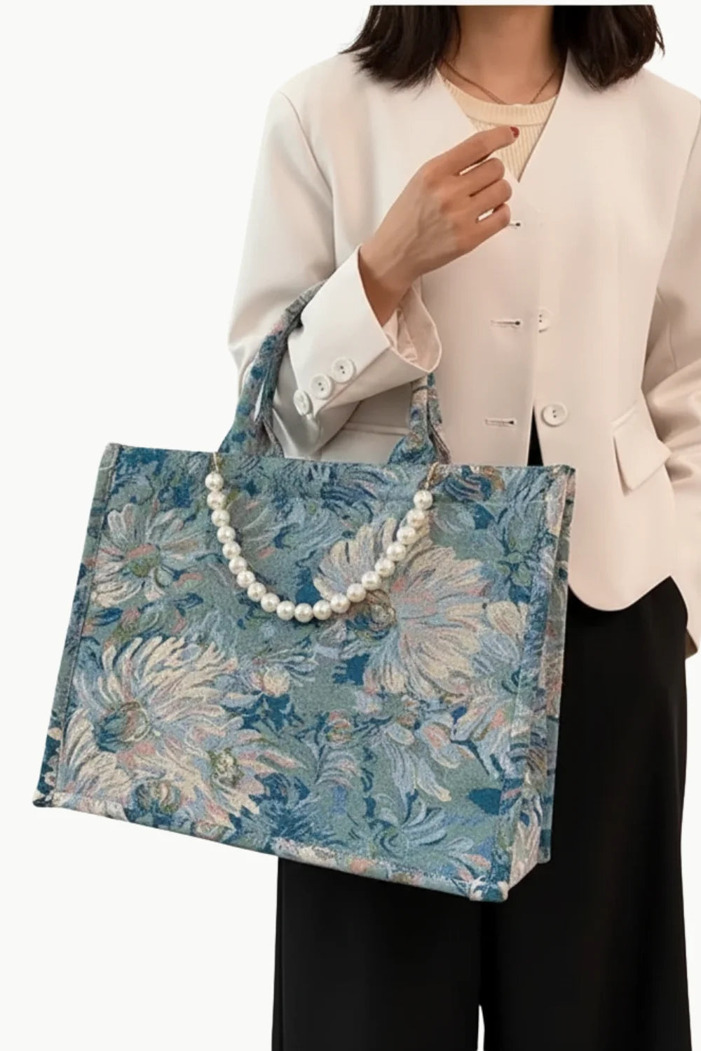 Floral print beaded beach tote bag with pearl-embellished handle for stylish beach days