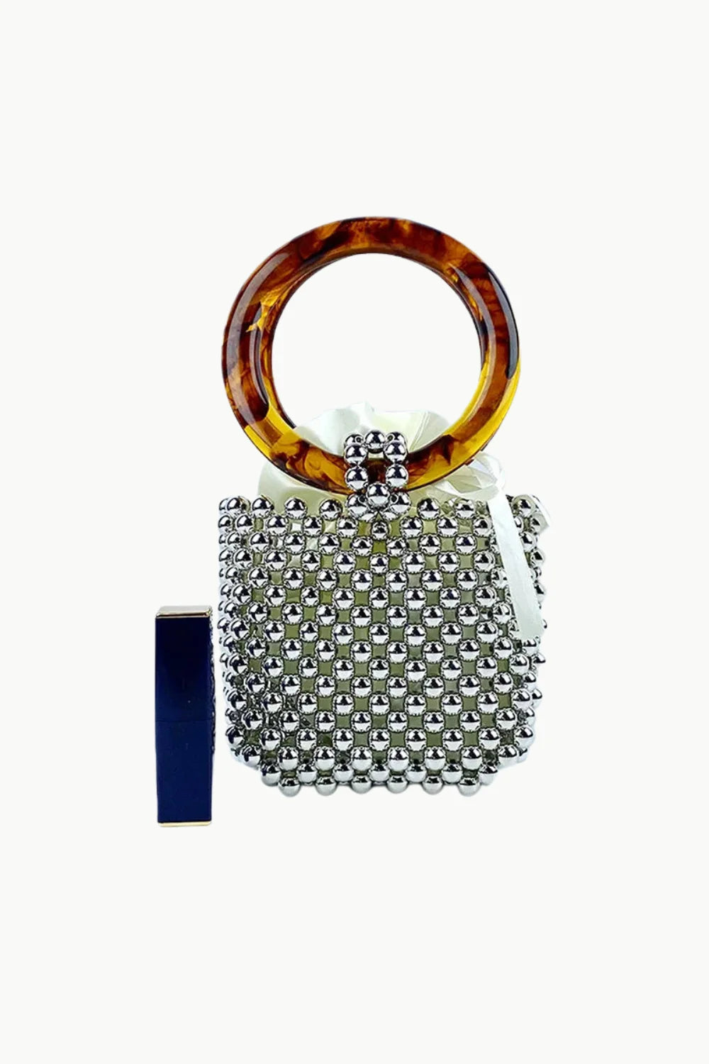 Silver beaded bucket bag with tortoiseshell handle and white drawstring closure