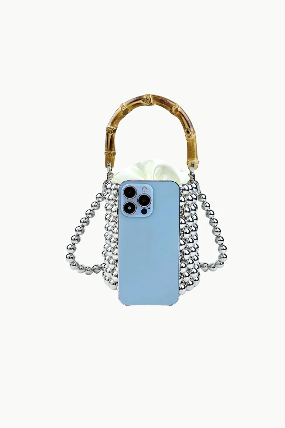 Light blue smartphone with bamboo handle and silver beaded crossbody bucket bag