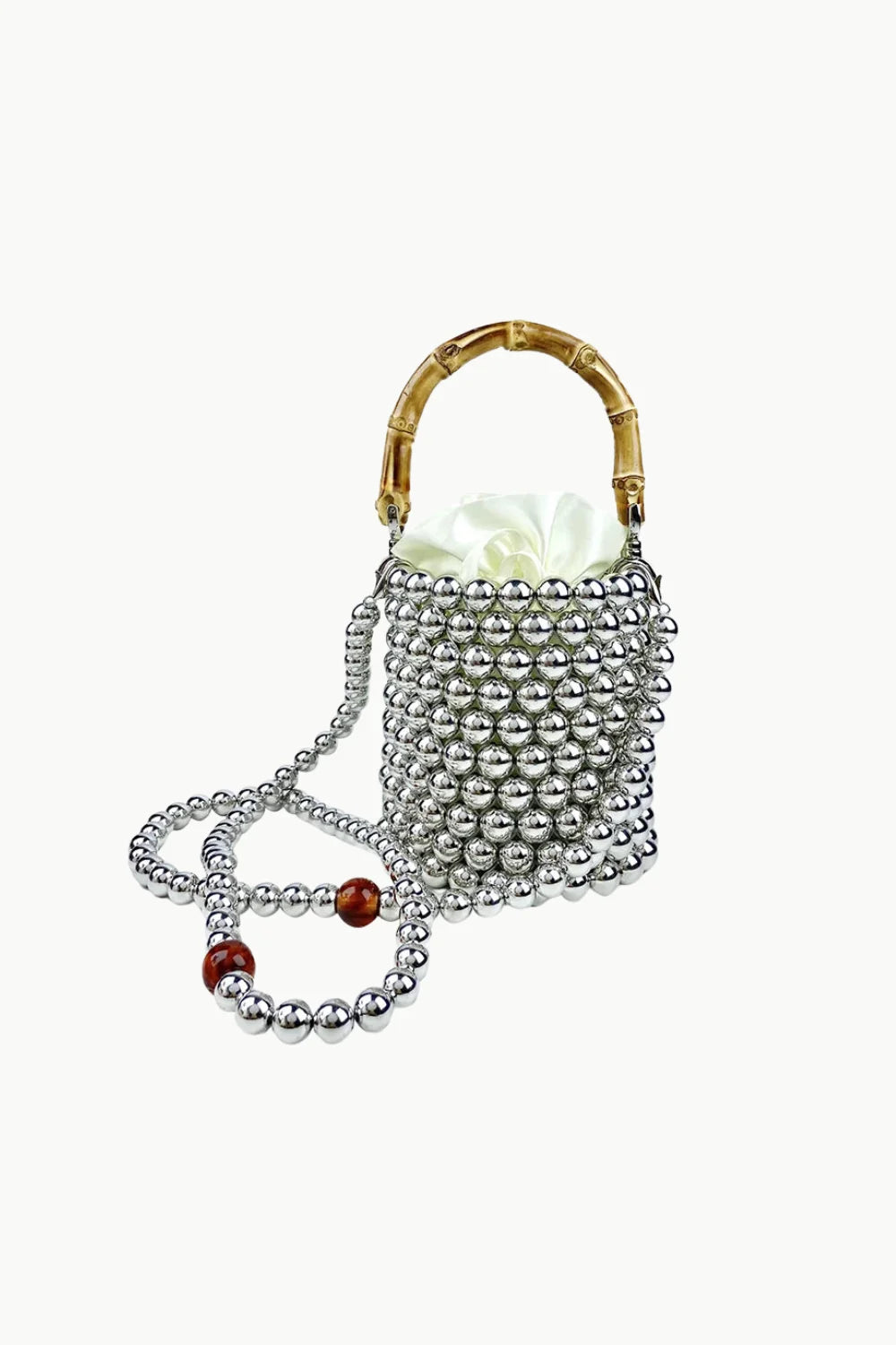 Silver beaded crossbody bucket bag with bamboo handle and red accents