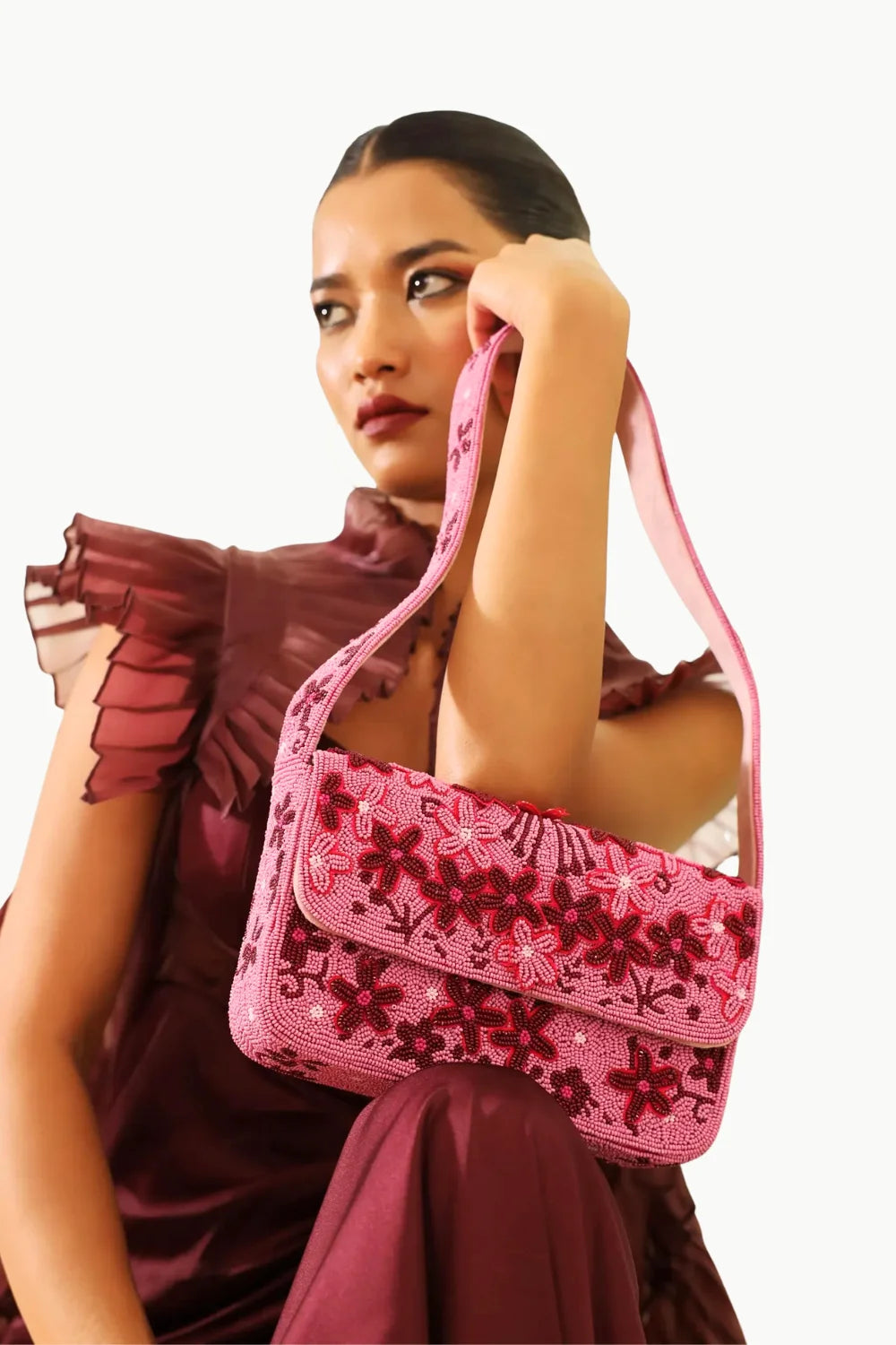 Pink floral beaded shoulder bag showcasing the stylish beaded floral handbag design