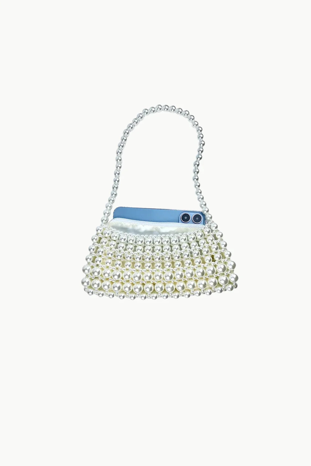 Beaded pearl purse with top handle holding a blue smartphone for elegant style