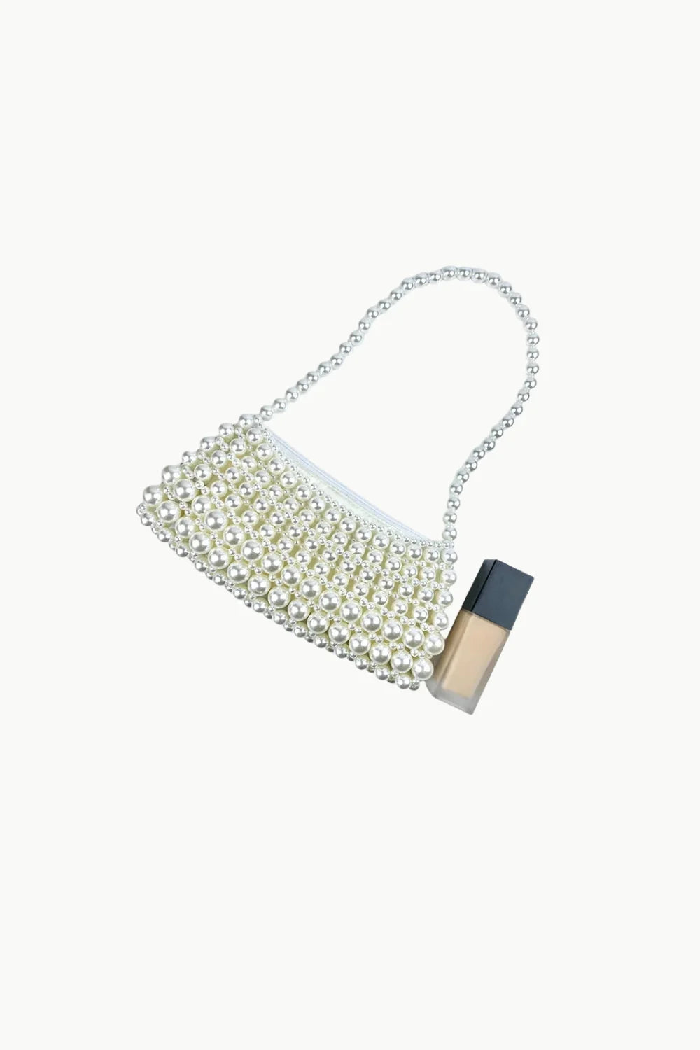 Beaded Pearl Purse with shoulder strap and neutral-toned Foundation Bottle