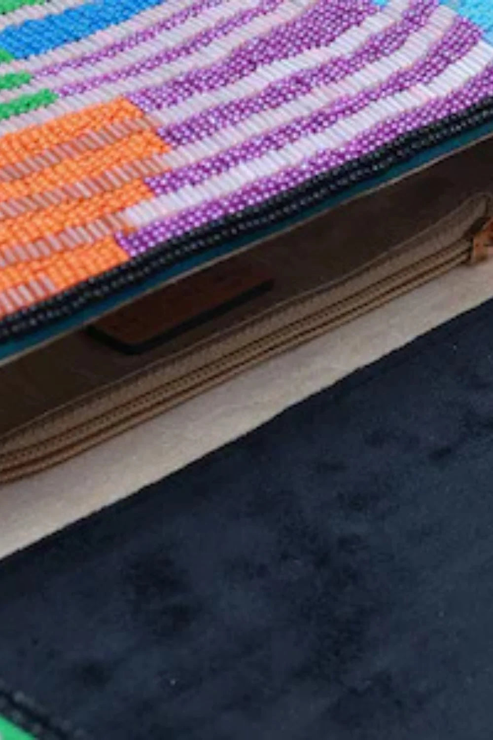 Vibrant striped beaded purse with black interior showcasing the beaded purse pattern