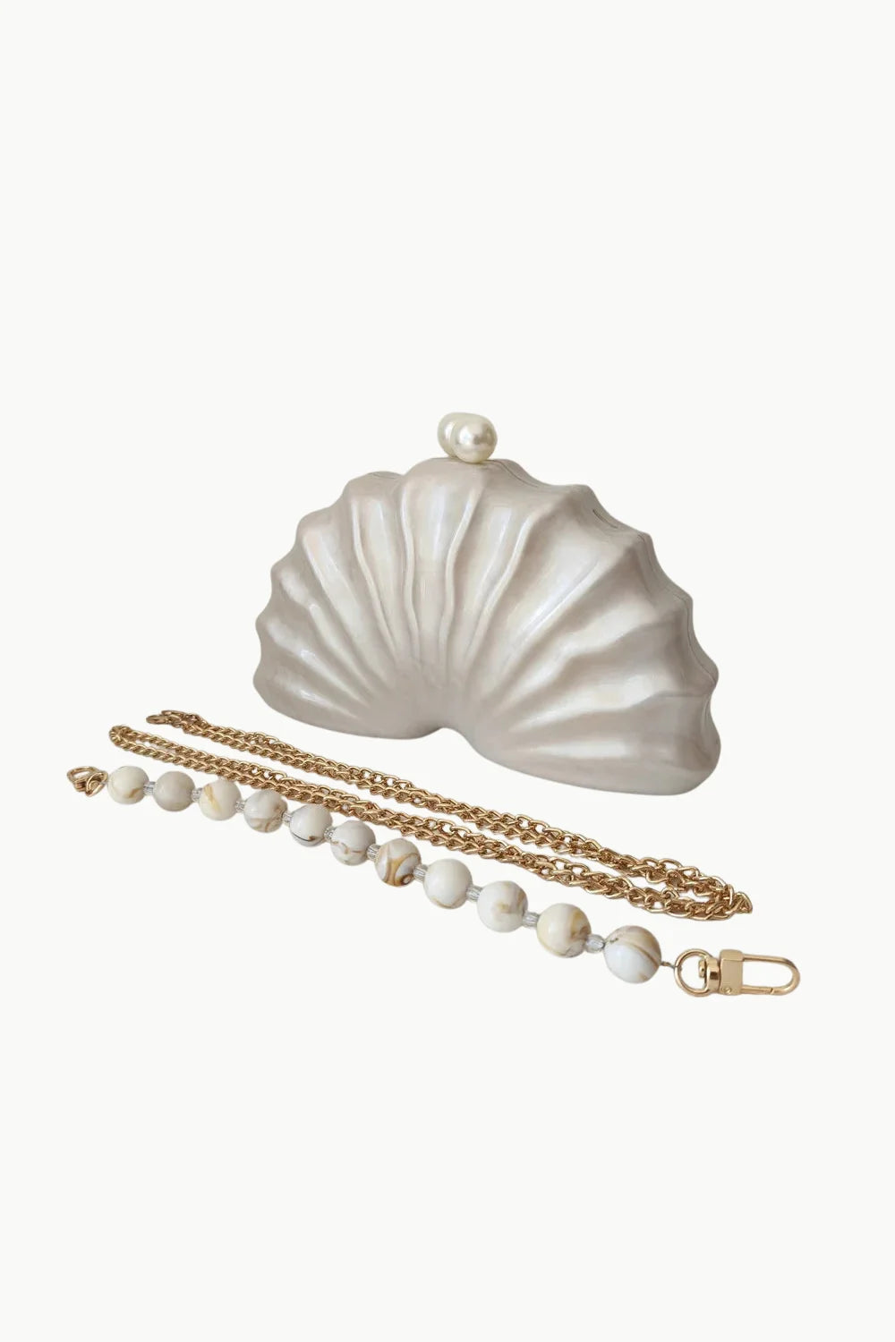 Beaded Shell Bag with pearl clasp, pearl seashell shape, gold chain, and beaded strap