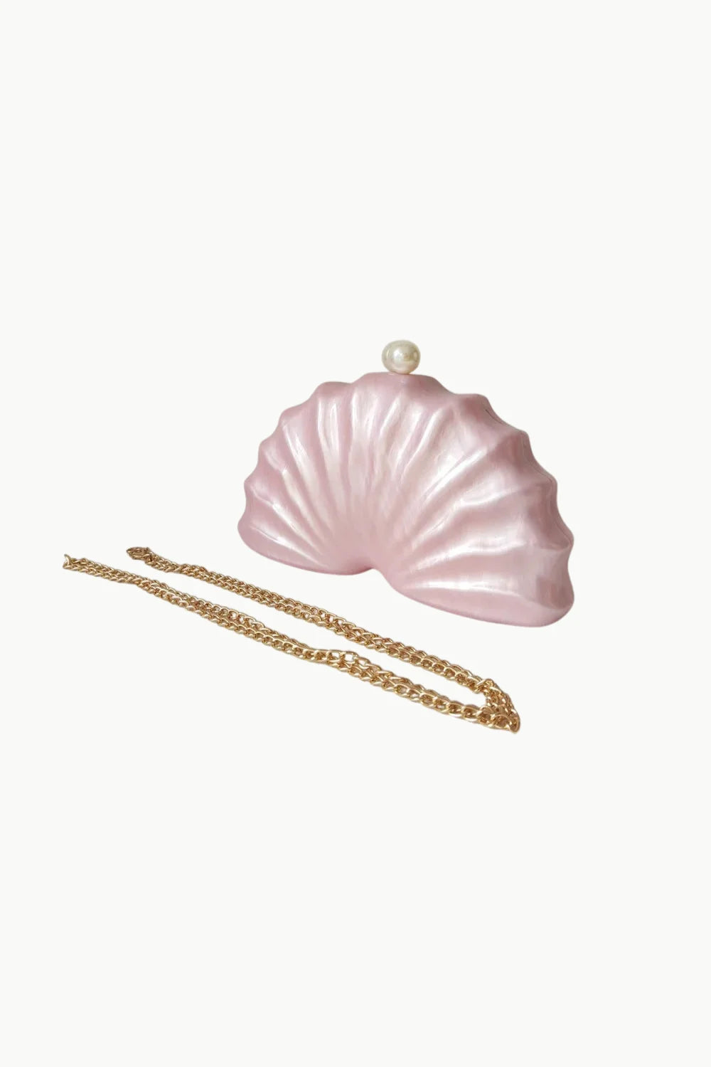 Pink beaded shell bag with pearl clasp and gold chain strap for elegant style