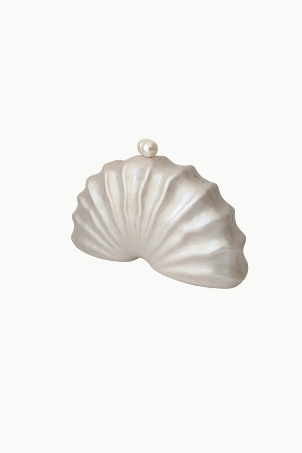 White seashell-shaped clutch with pearl clasp showcasing the Beaded Shell Bag style