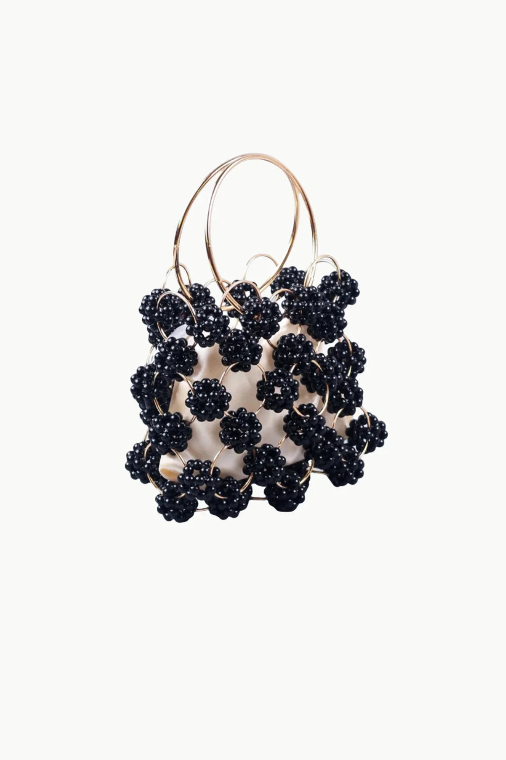 Black beaded bucket bag with white interior and round metallic handles for stylish carry