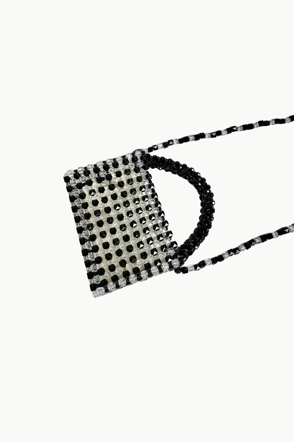Black and white beaded bag with short handle and long shoulder strap for stylish looks
