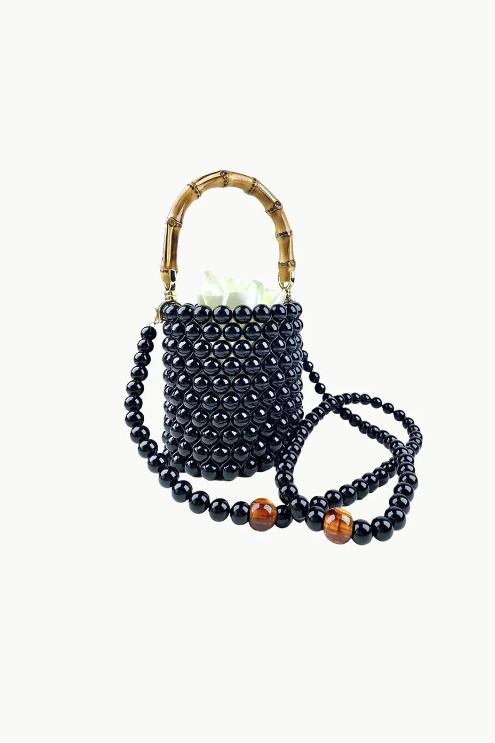 Black beaded bucket bag with bamboo handles and amber beads for stylish accessories