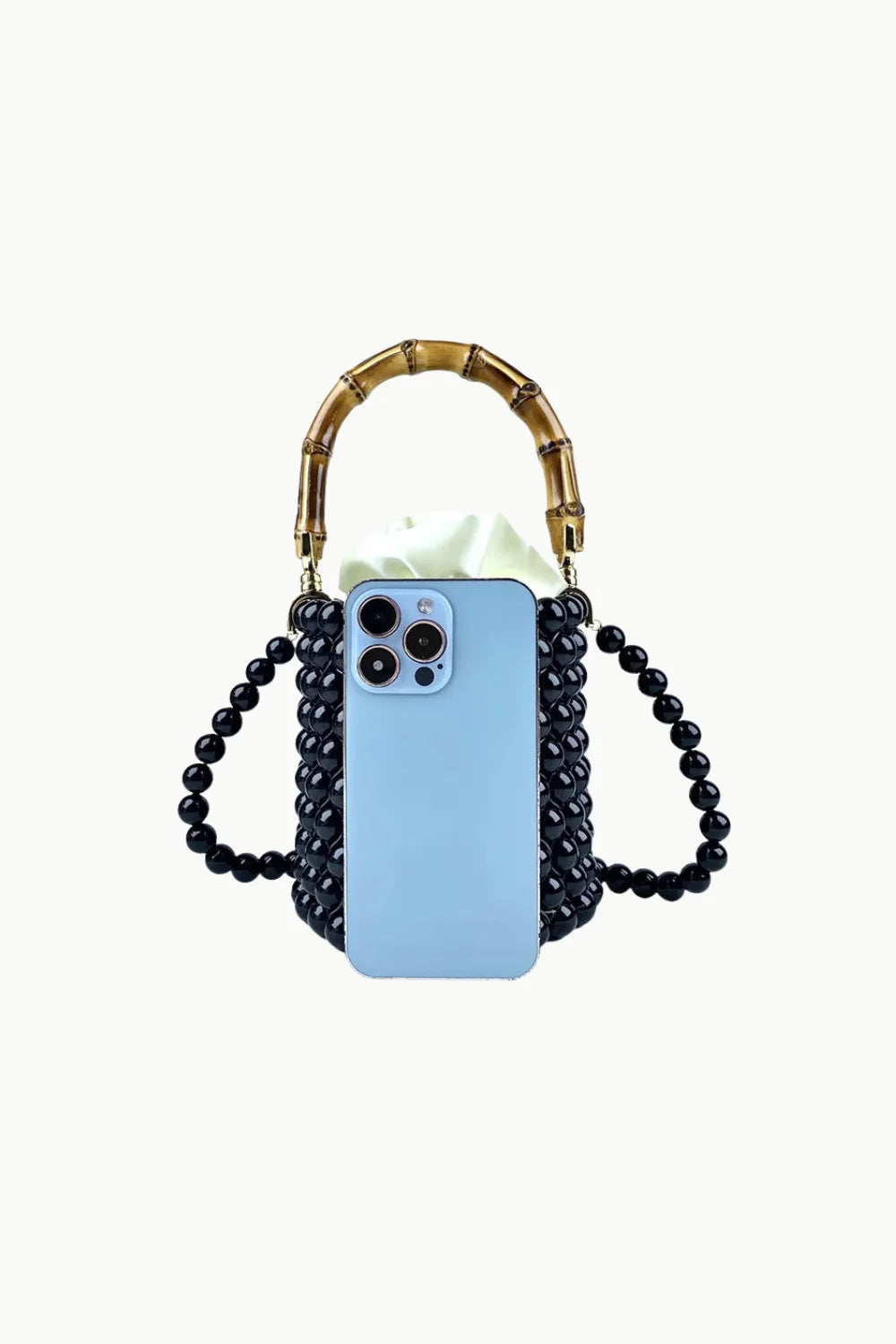 Black beaded bucket bag with bamboo handle and light blue smartphone inside
