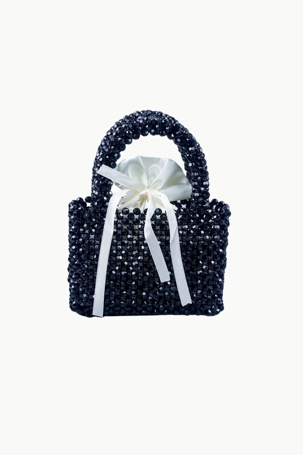 Black beaded handbag with white satin drawstring pouch and bow for elegant accessories