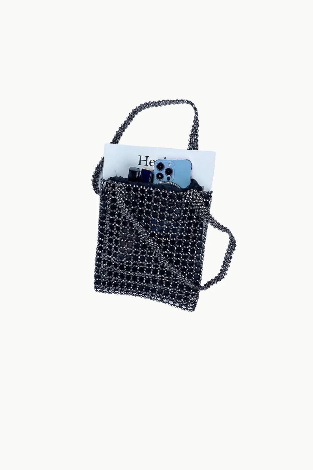 Black beaded tote bag with open top holding white paper and light blue smartphone