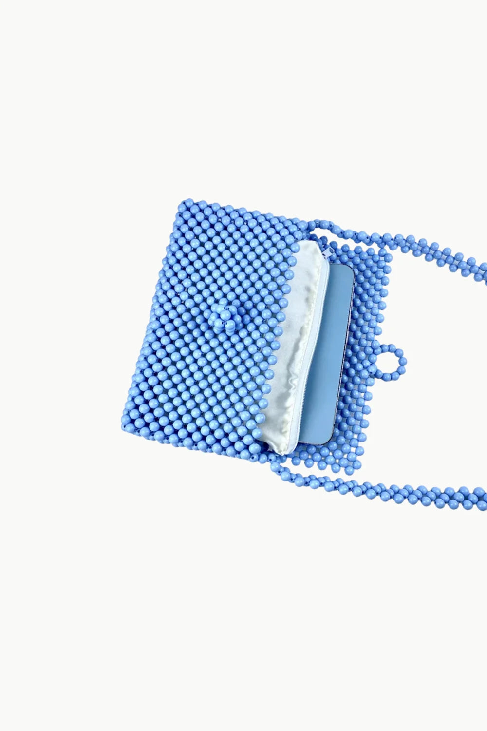 Light blue beaded shoulder bag with flap closure and strap for stylish accessories